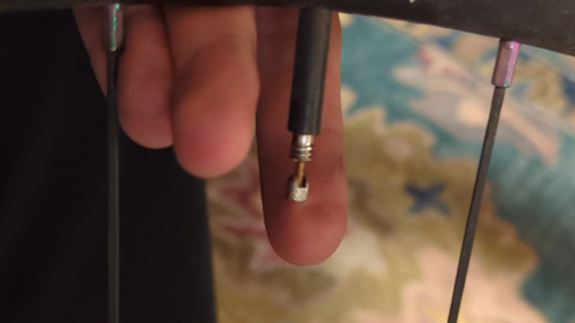 Presta valve on TPU tube farts and only lets air out very slowly. I can pump it up but the pump has to get to ~80 PSI before the tube (at ~50) starts accepting air. Anyone know what's going on? Should I be fine to continue riding on it assuming I get it pumped up fine?