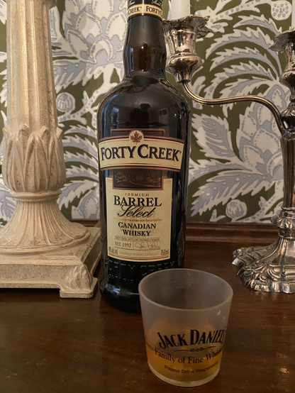 Photo of a Jack Daniels shot glass, but with Forty Creek Canadian whisky in it instead.