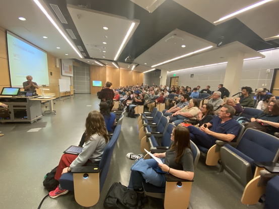 A wide shot of the students, faculty, and community members who enjoyed the worldwide stories of fermentation told by Sandor Katz, and were looking forward to sampling krauts and other fermented creations at the reception and book-signing in the Special Collections Room of the Walker Library.