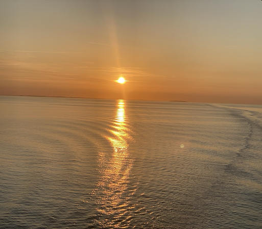 At 9:33 pm the sun is still above a tranquil Baltic Sea between the Danish islands of Funen and Zealand.